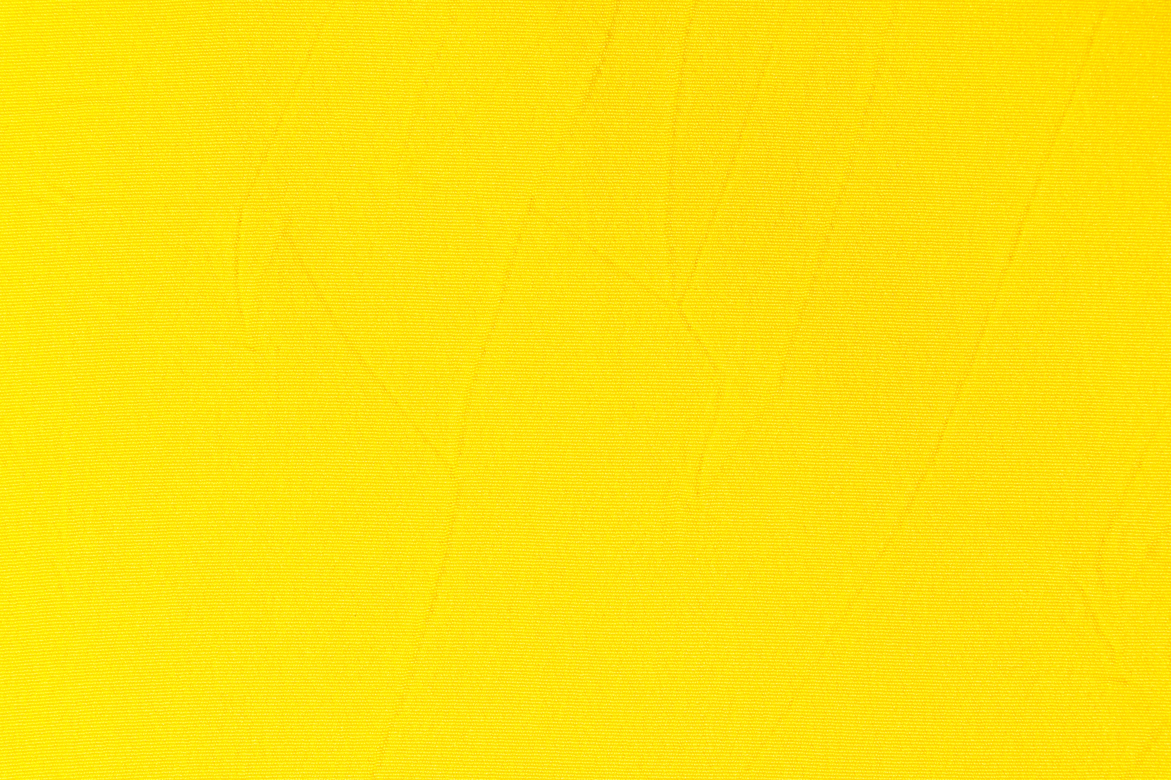 Yellow background. Yellow Synthetic fabric texture, background. Yellow fabric.